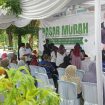 Kepala Bagian Perekonomian Sekretariat Daerah Kabupaten Sumenep, Dadang Dedy Iskandar, selaku TPID nampak bersemangat mengawasi jalannya pasar murah EPIK Mobile. ©timeskota.com